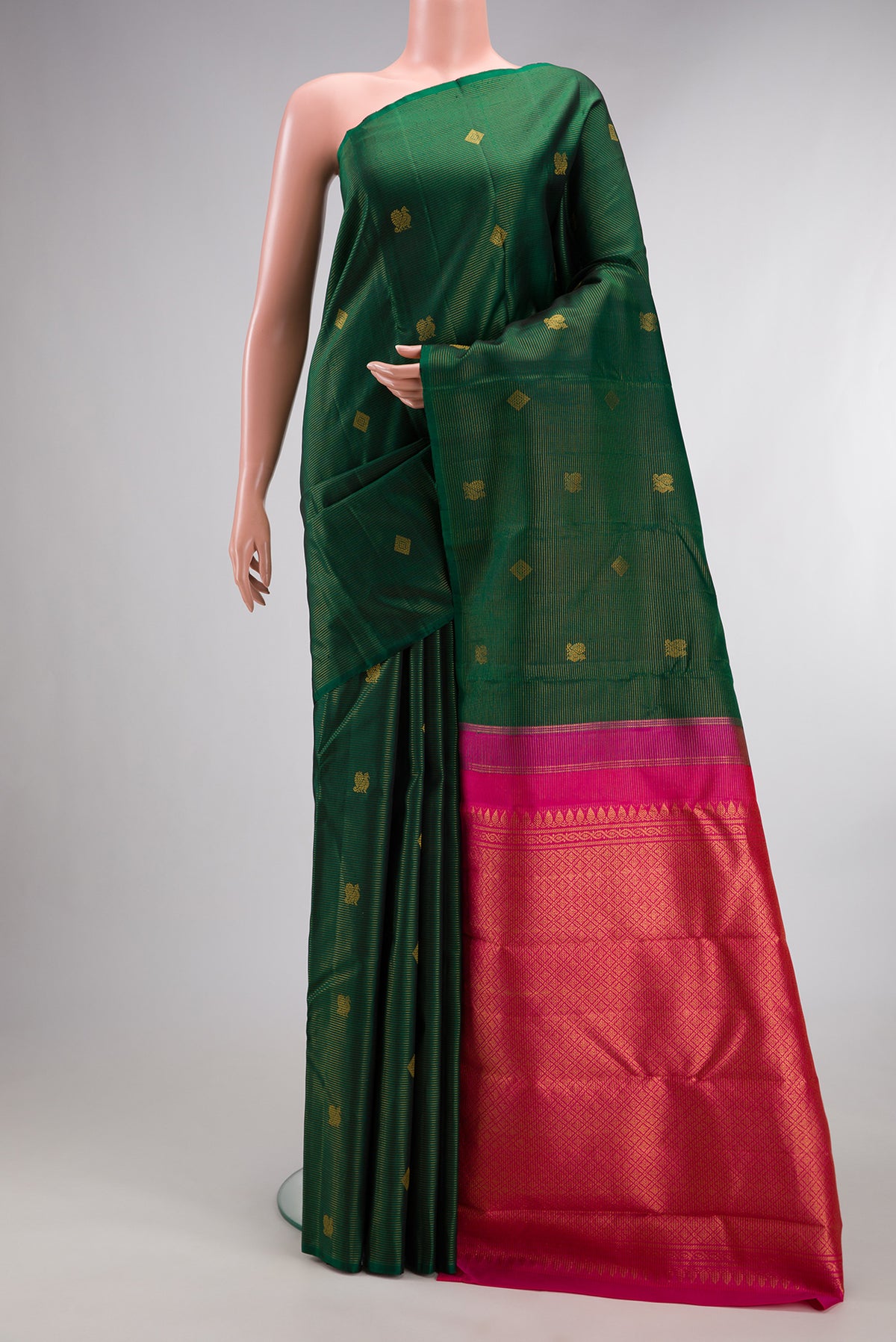 Pure Silk Bottle Green Kanjivaram Saree with Stripes on the body and Without Border.  displayed on a mannequin