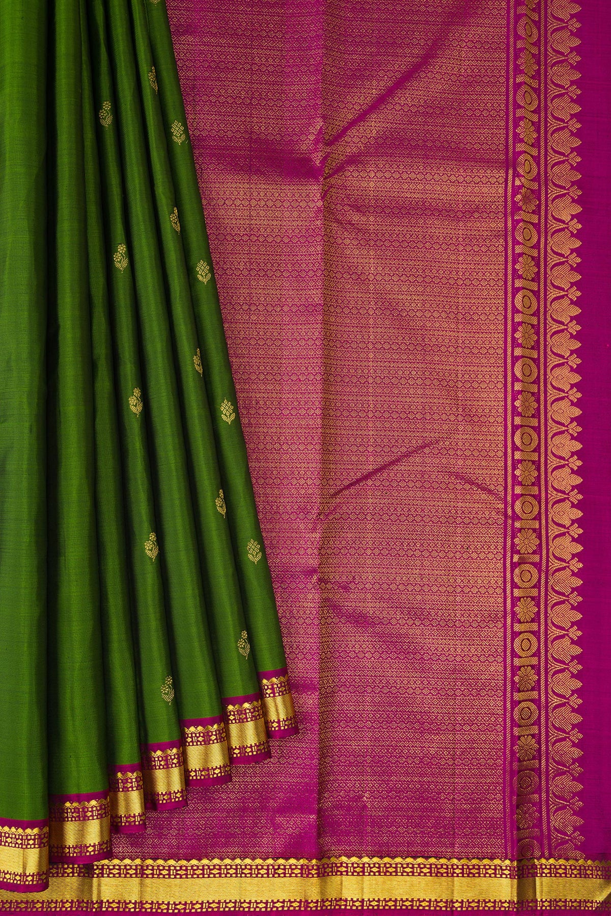 Pleats and pallu of Pure Silk Mehandi Green Kanchipuram Saree with Zari Butta on the body and Zari Border. 