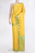 Pure Silk Yellow Kanchipuram Saree with Zari Butta on the body and Zari Border.  displayed on a mannequin