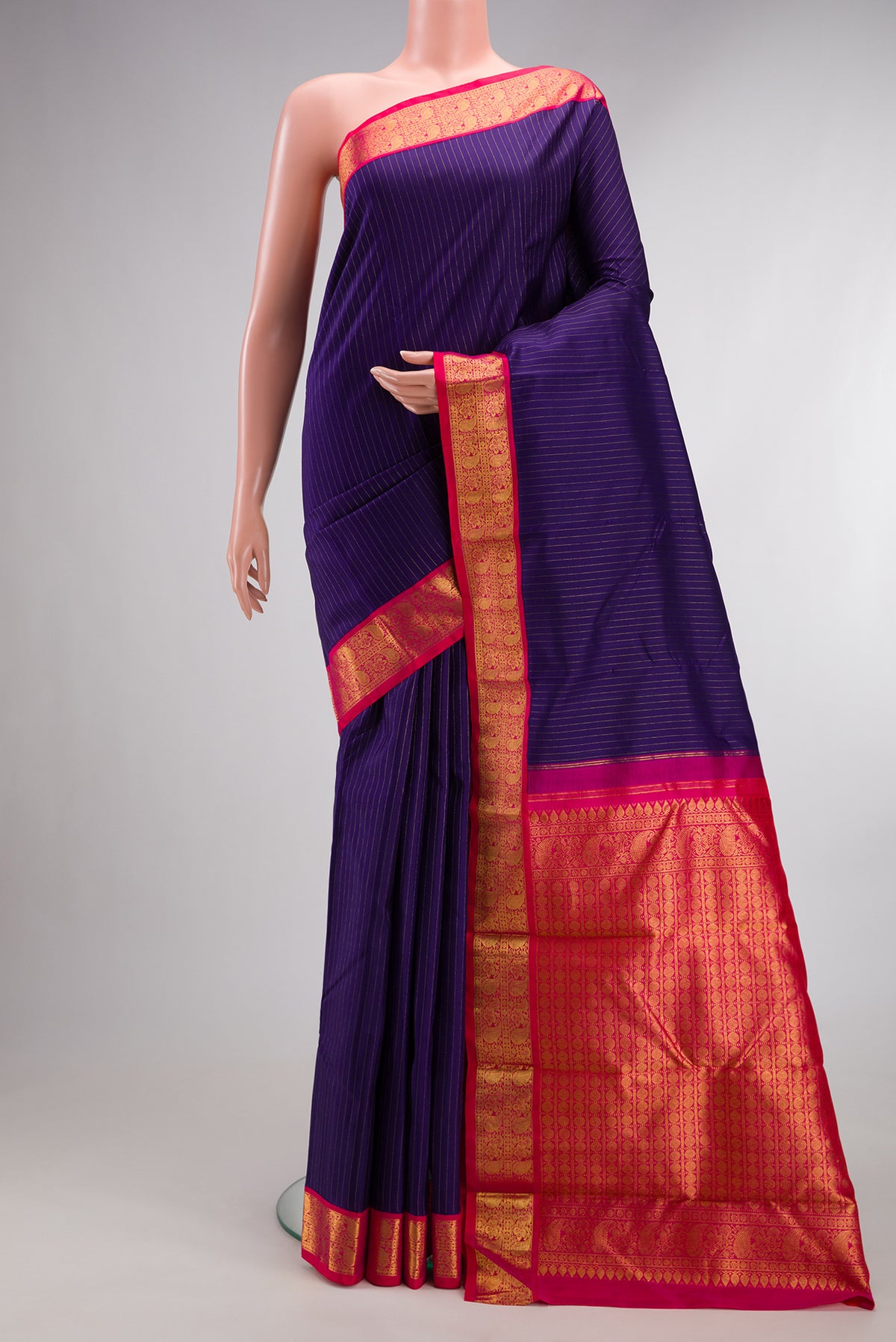 Pure Silk Navy Blue Kanjivaram Saree with Stripes on the body and Zari Border.  displayed on a mannequin