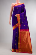 Pure Silk Royal Blue Kanjivaram Saree with Zari Butta on the body and Zari Border.  displayed on a mannequin