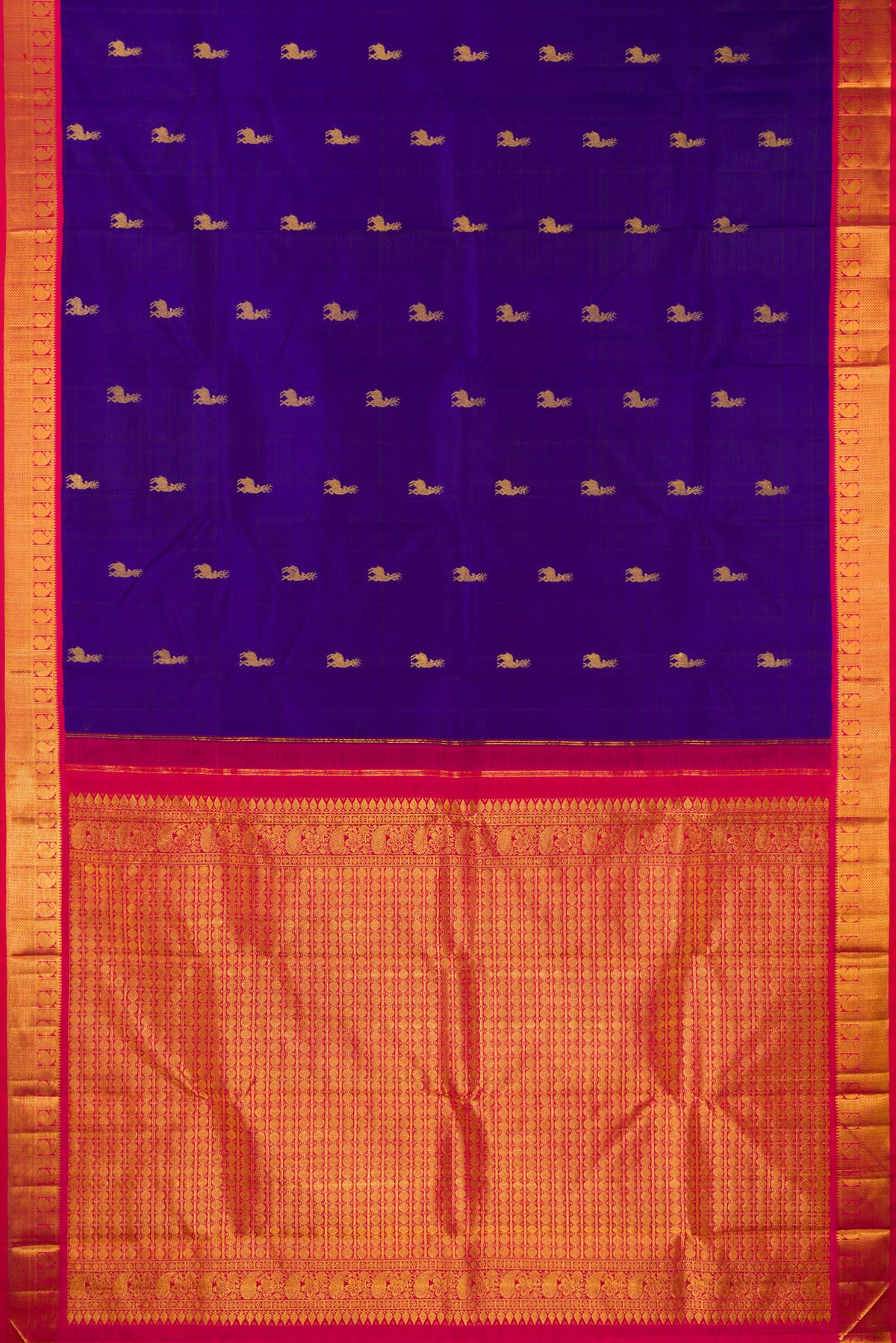 Flat view of Pure Silk Royal Blue Kanjivaram Saree with Zari Butta on the body and Zari Border. 