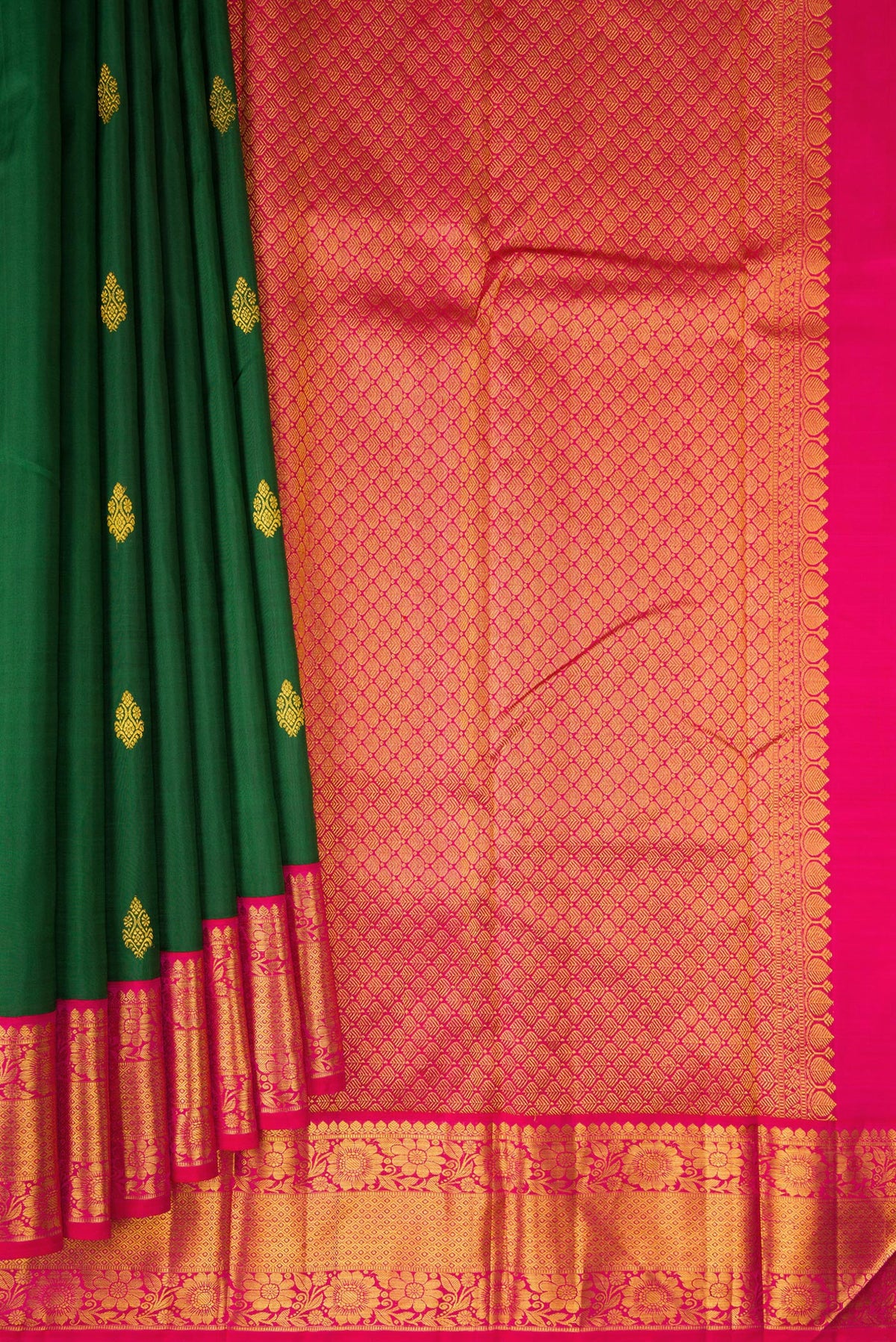 Pleats and pallu of Pure Silk Bottle Green Kanjivaram Saree with Zari Butta on the body and Zari Border. 