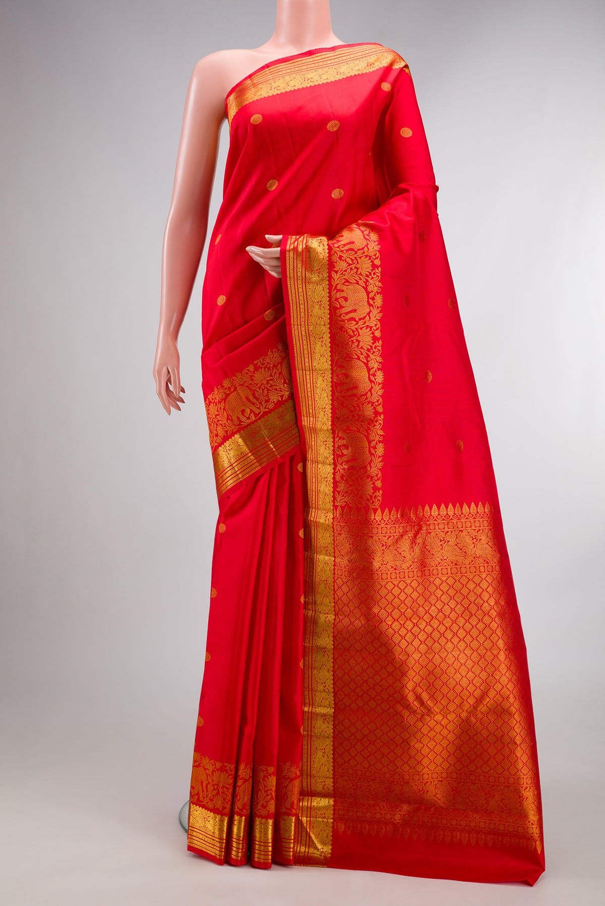 Pure Silk Red Dual Tone Kanjivaram Saree with Zari Butta on the body and Fancy Border.  displayed on a mannequin