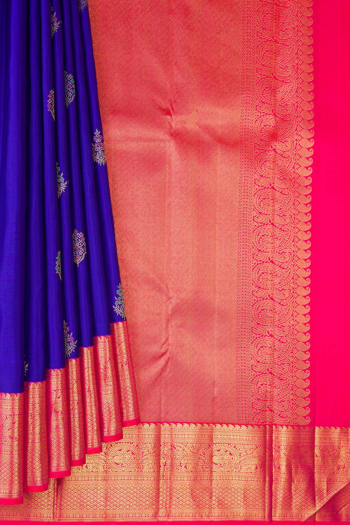 Pleats and pallu of Pure Silk Royal Blue Kanjivaram Saree with Zari And Thread Butta on the body and Zari Border. 