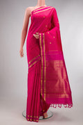 Pure Silk Coral Kanchipuram Saree with Zari Butta on the body and Zari Border.  displayed on a mannequin