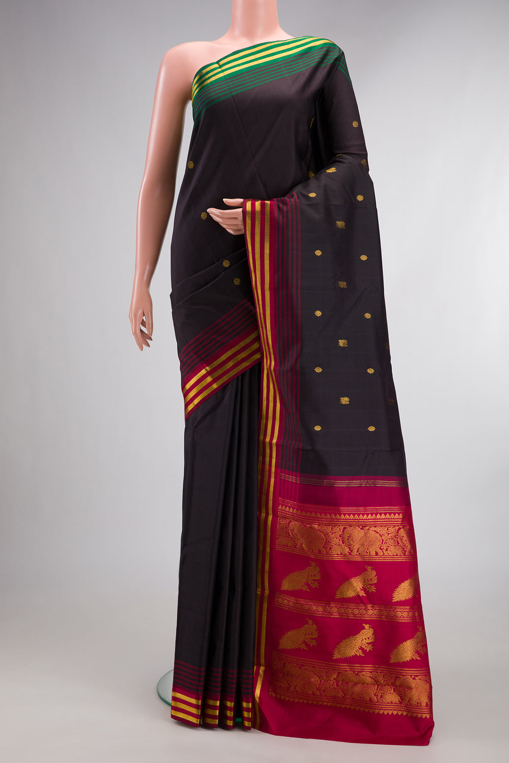 Pure Silk Coffee Brown Kanjivaram Saree with Zari Butta on the body and Ganga Jamuna Border.  displayed on a mannequin