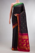 Pure Silk Coffee Brown Kanjivaram Saree with Zari Butta on the body and Ganga Jamuna Border.  displayed on a mannequin