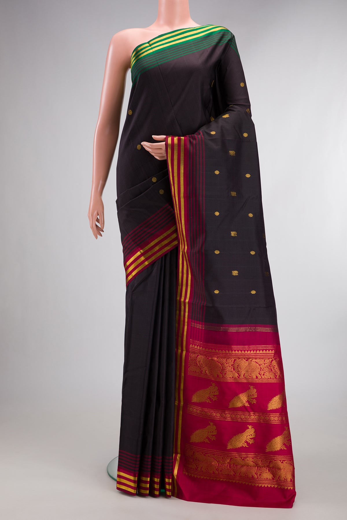 Pure Silk Coffee Brown Kanjivaram Saree with Zari Butta on the body and Ganga Jamuna Border.  displayed on a mannequin