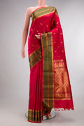 Pure Silk Red Kanjivaram Saree with Zari Butta on the body and Zari And Thread Border.  displayed on a mannequin