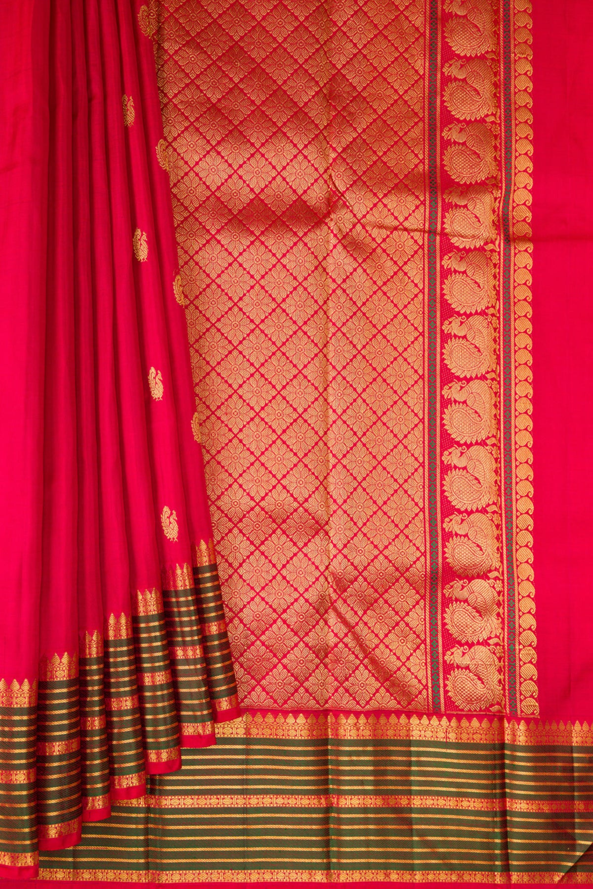 Pleats and pallu of Pure Silk Red Kanjivaram Saree with Zari Butta on the body and Zari And Thread Border. 