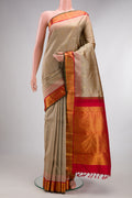 Pure Silk Dark Beige Kanjivaram Saree with Zari Butta on the body and Zari Border.  displayed on a mannequin