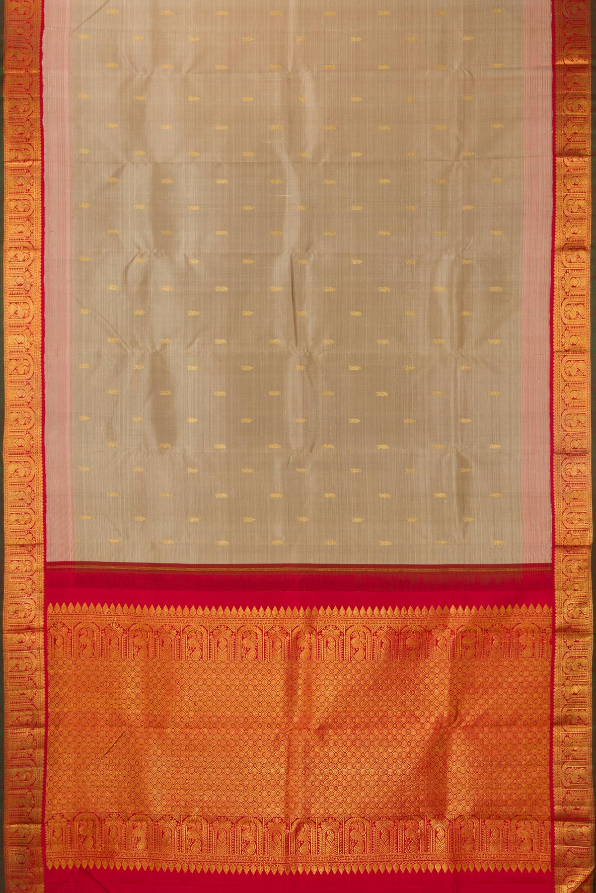 Flat view of Pure Silk Dark Beige Kanjivaram Saree with Zari Butta on the body and Zari Border. 