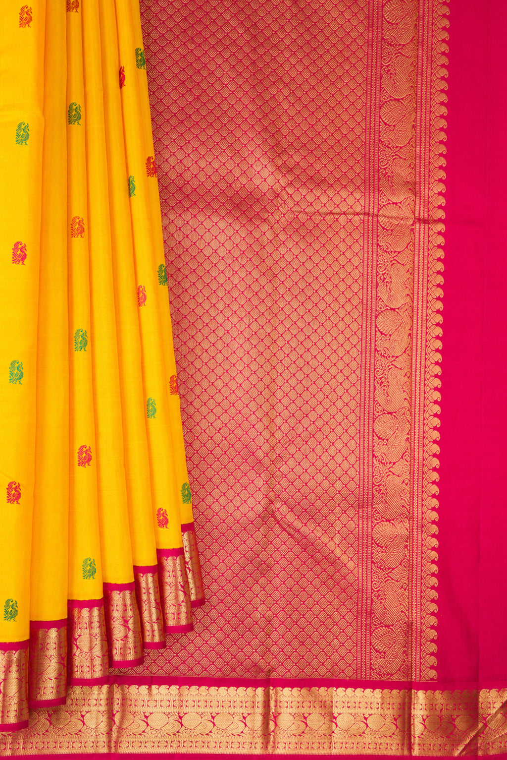 Pleats and pallu of Pure Silk Mustard Kanjivaram Saree with Thread Butta on the body and Zari Border. 