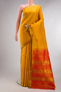 Pure Silk Mustard Kanchipuram Saree with Zari Butta on the body and Zari Border.  displayed on a mannequin