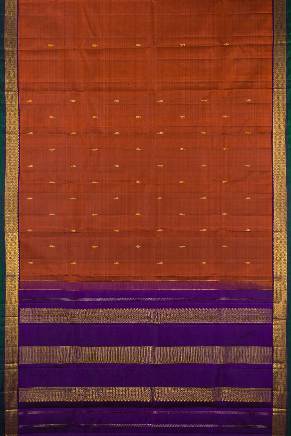 Flat view of Pure Silk Rust Kanchipuram Saree with Zari Butta on the body and Zari Border. 