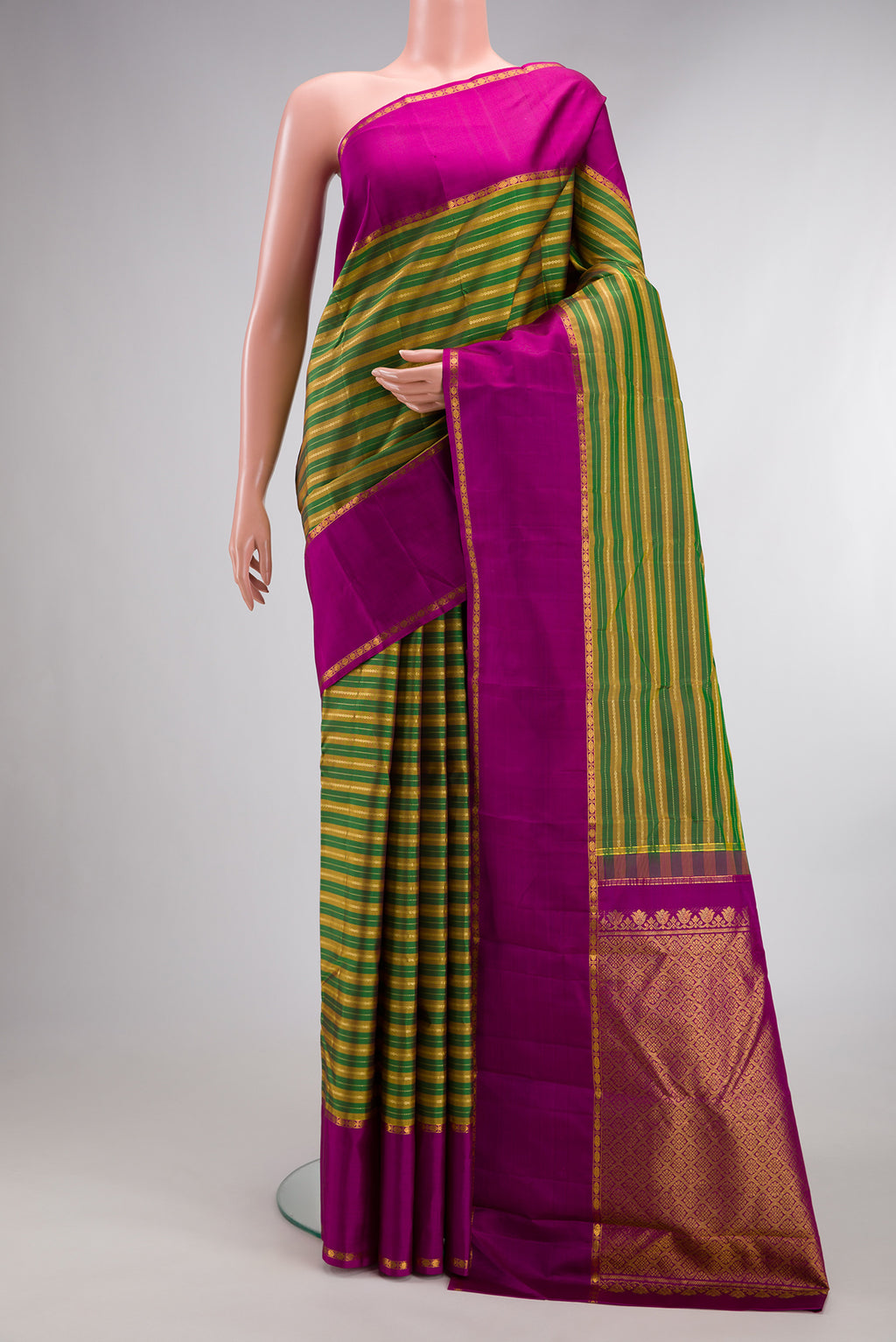 Pure Silk Green Kanchipuram Saree with Stripes on the body and Zari Border.  displayed on a mannequin