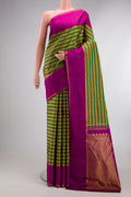 Pure Silk Green Kanchipuram Saree with Stripes on the body and Zari Border.  displayed on a mannequin
