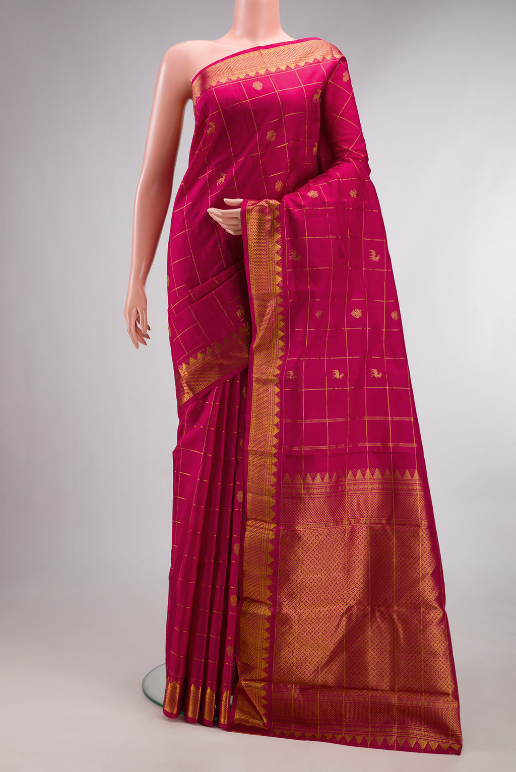 Pure Silk Dark Pink Kanjivaram Saree with Checked design on the body and Zari Border.  displayed on a mannequin