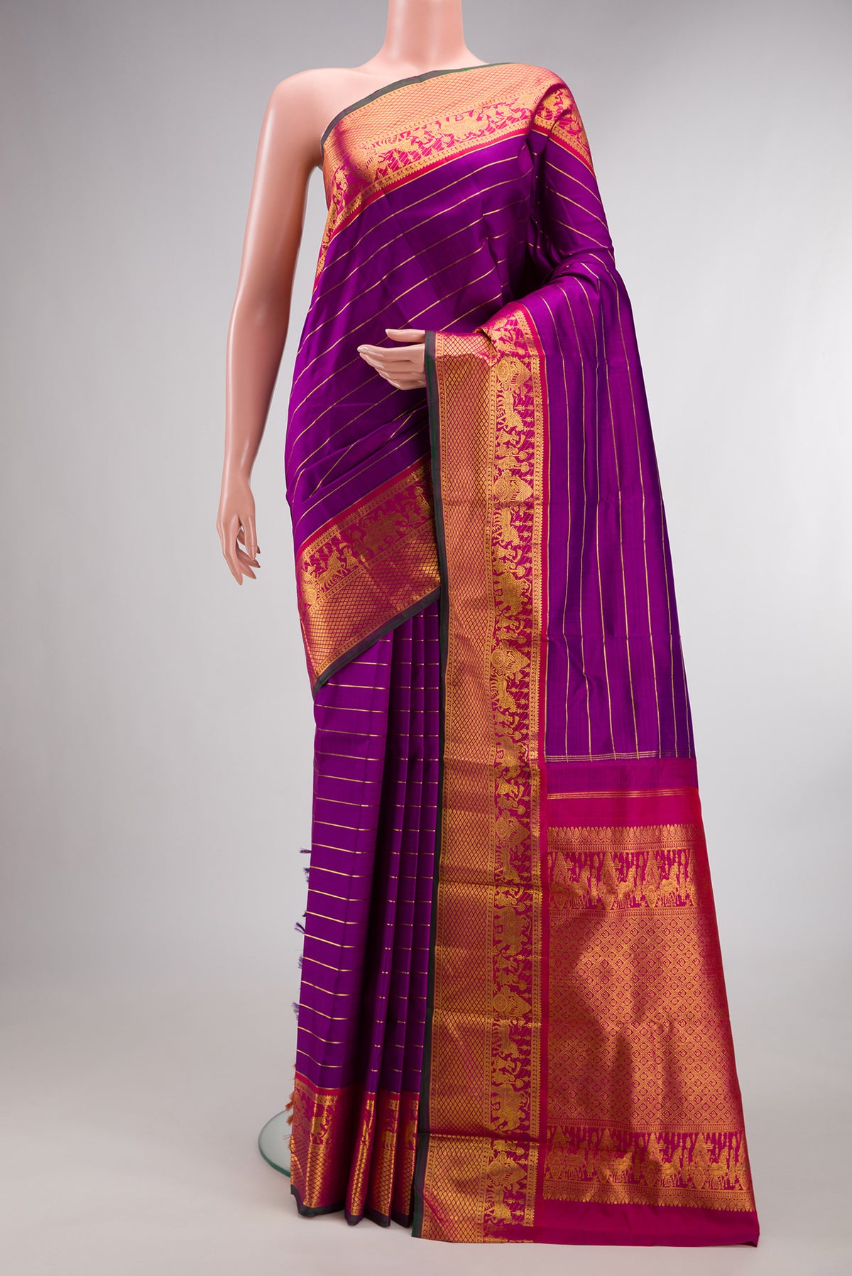 Pure Silk Purple Kanjivaram Saree with Veldhari on the body and Zari Border.  displayed on a mannequin