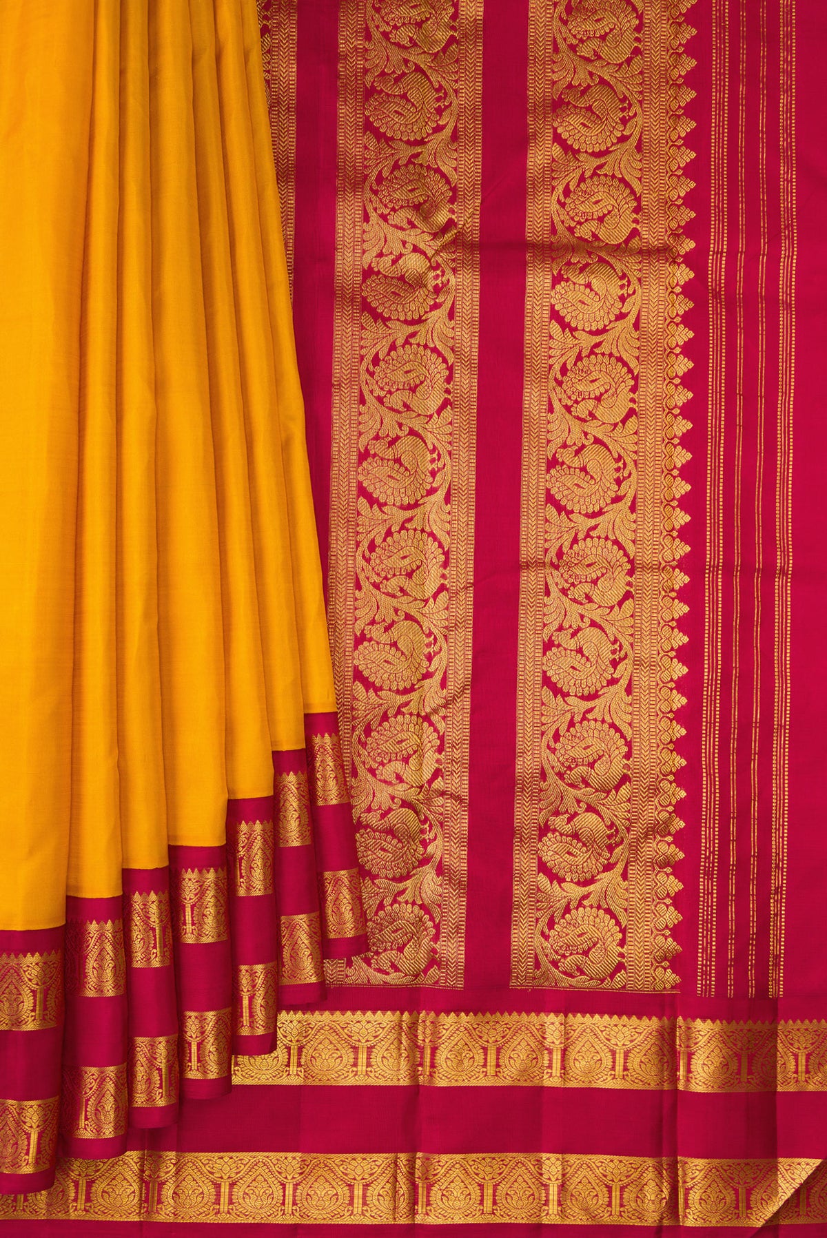 Pleats and pallu of Pure Silk Mustard Kanjivaram Saree with Plain Body and Zari Border. 