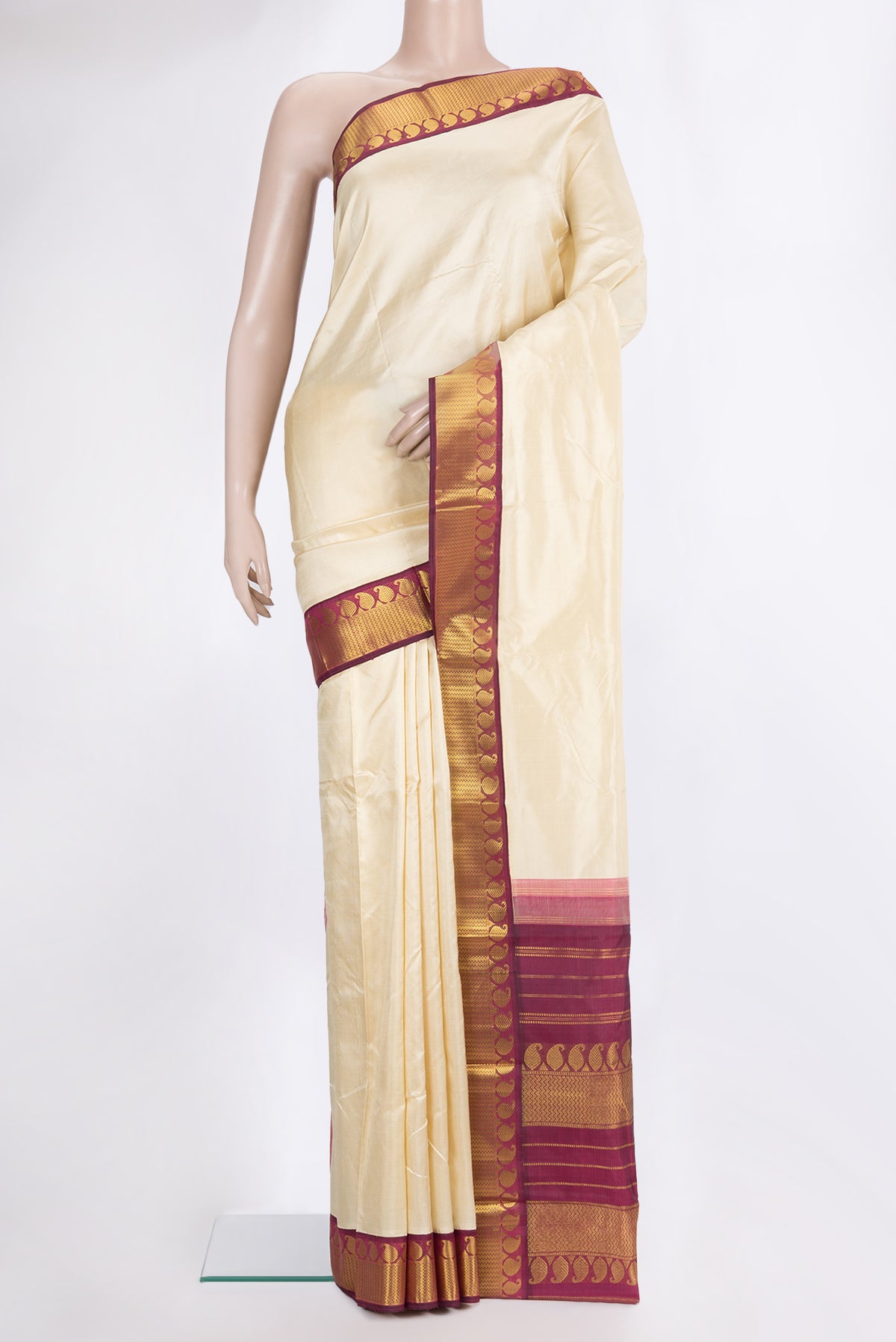 Pure Silk Sandal Kanjivaram Saree with Plain Body and Zari Border.  displayed on a mannequin