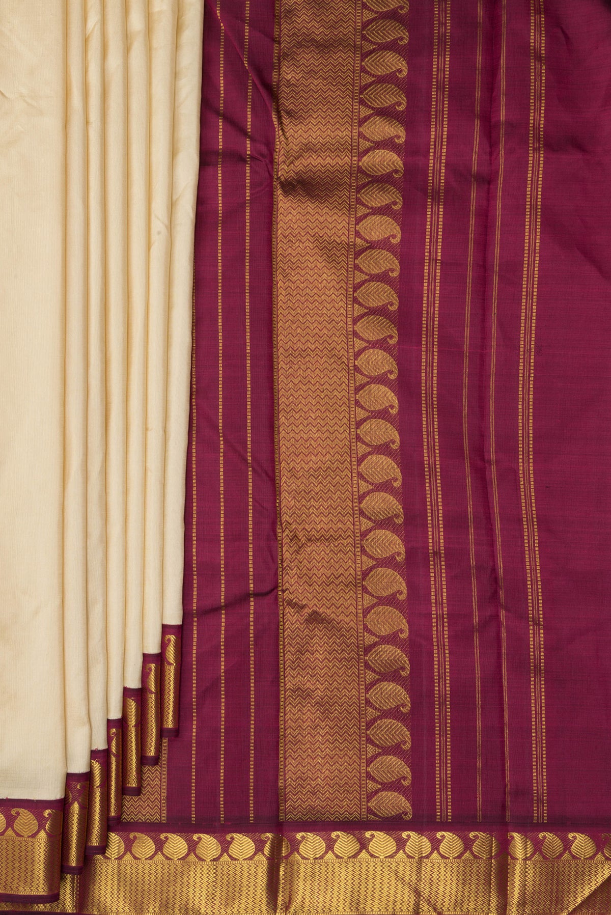 Pleats and pallu of Pure Silk Sandal Kanjivaram Saree with Plain Body and Zari Border. 
