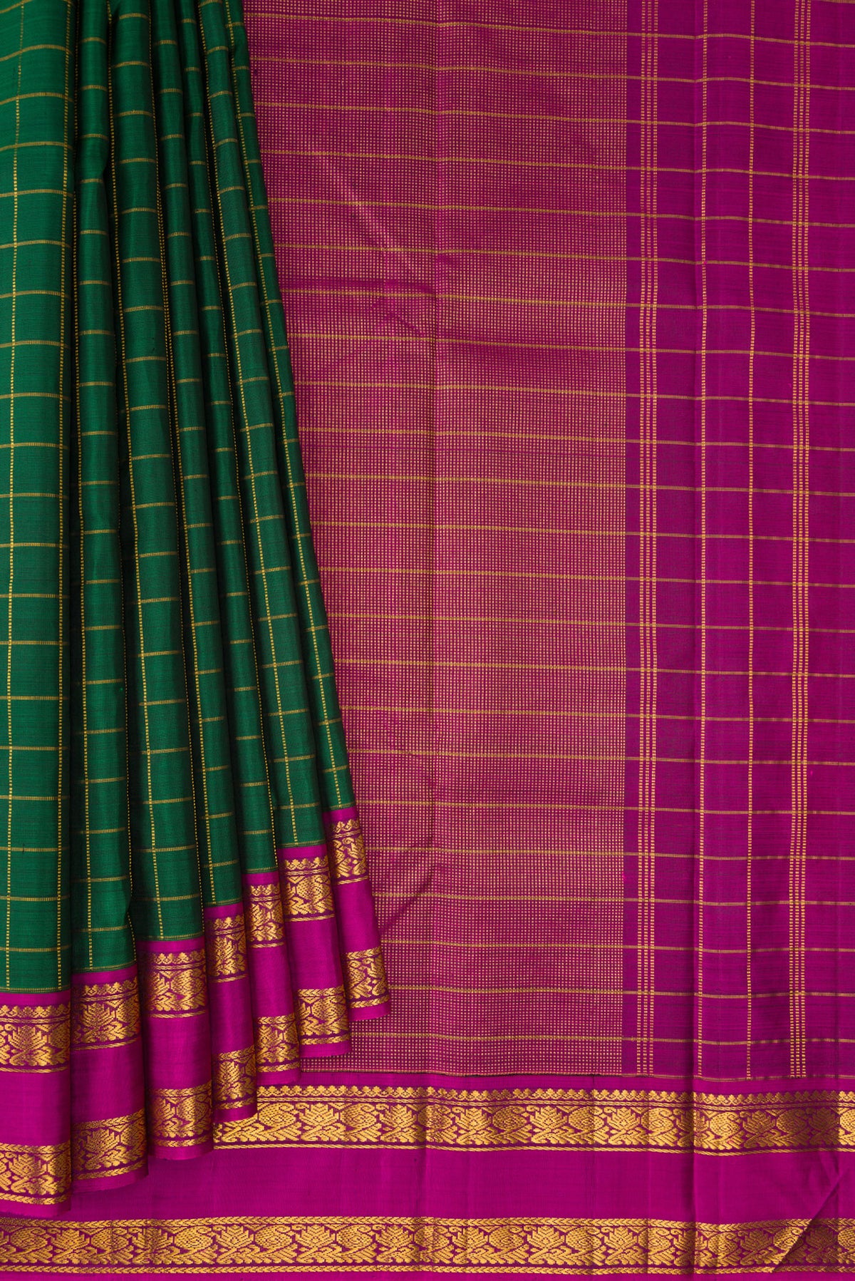 Pleats and pallu of Pure Silk Bottle Green Kanchipuram Saree with Checked design on the body and Zari Border. 