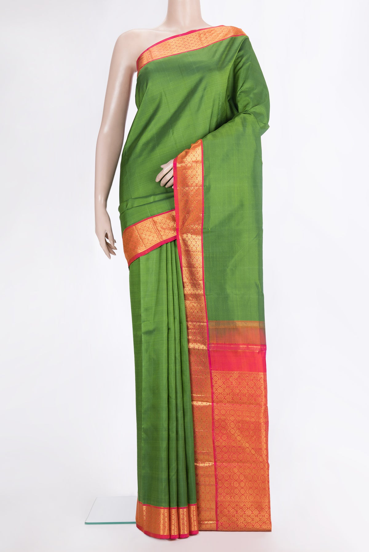 Pure Silk Green Kanjivaram Saree with Plain Body and Zari Border.  displayed on a mannequin