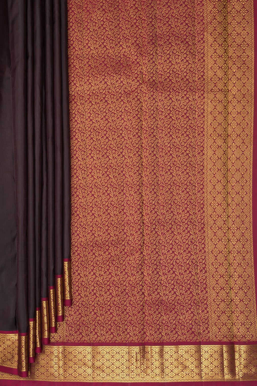 Pleats and pallu of Pure Silk Brown Kanchipuram Saree with Plain Body and Zari Border. 