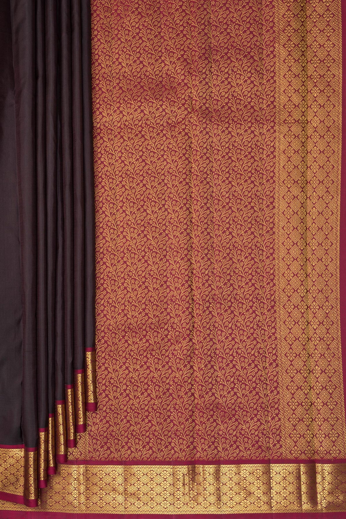 Pleats and pallu of Pure Silk Brown Kanchipuram Saree with Plain Body and Zari Border. 