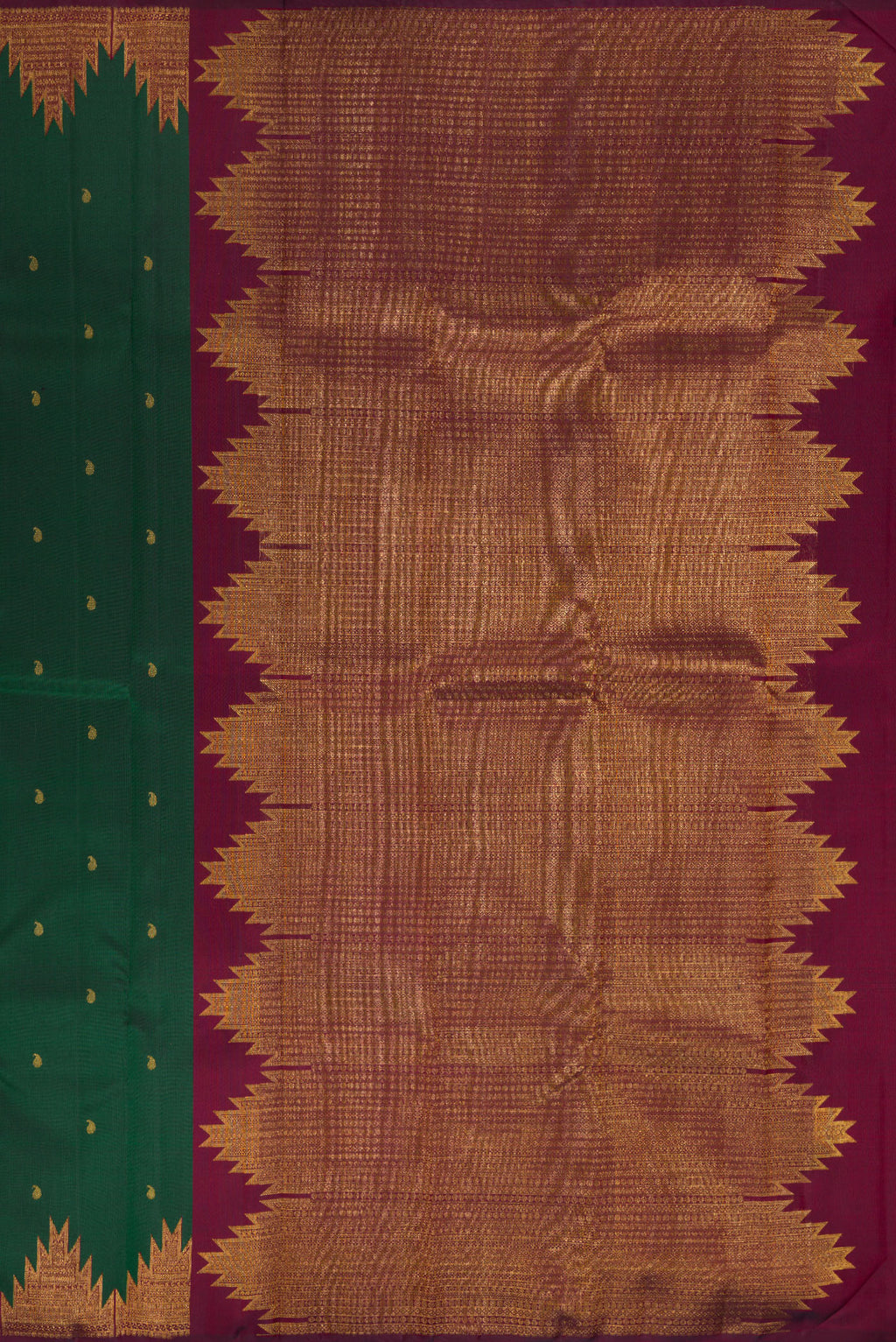 Close up image of the pallu of Pure Silk Bottle Green Kanchipuram Saree with Zari Butta on the body and Temple Border. 