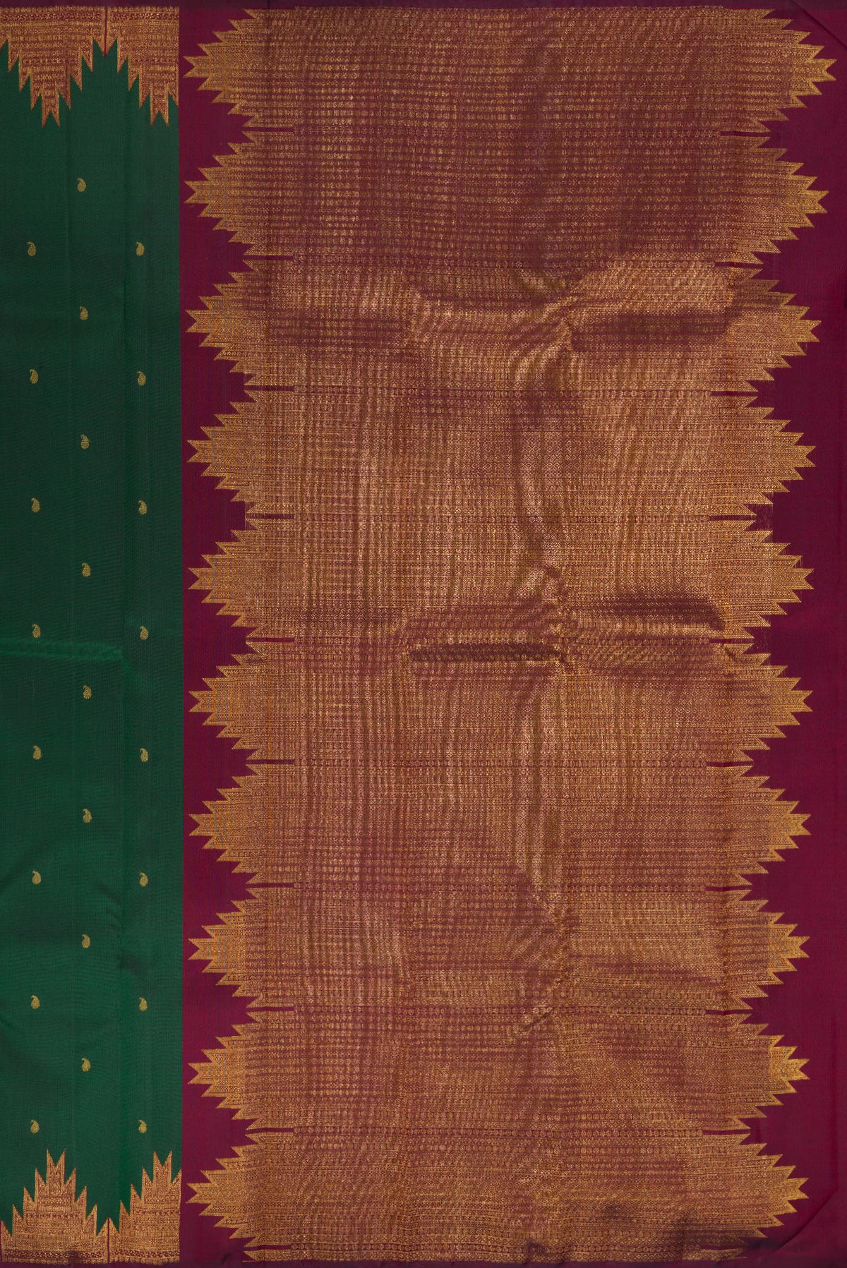 Close up image of the pallu of Pure Silk Bottle Green Kanchipuram Saree with Zari Butta on the body and Temple Border. 