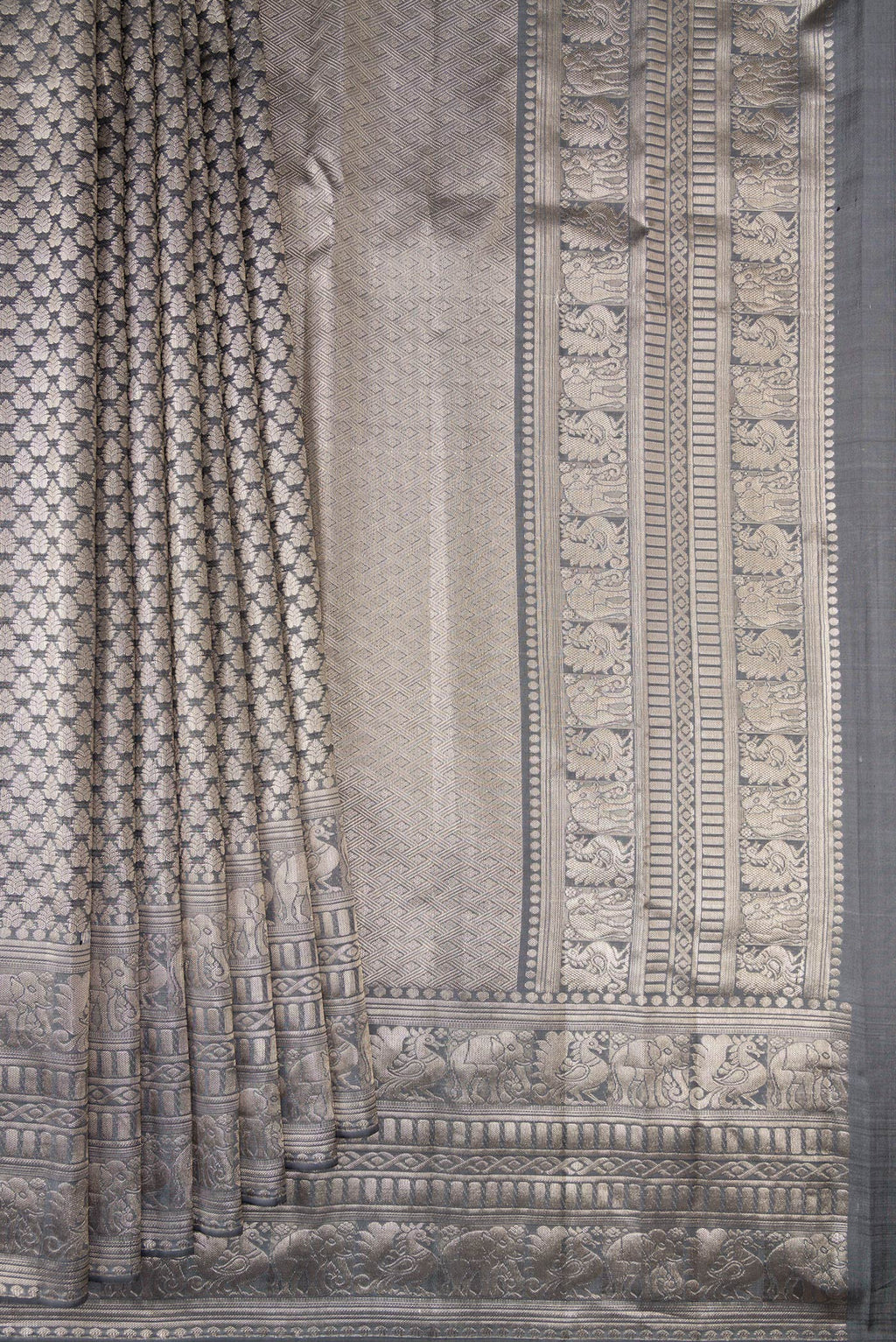 Pleats and pallu of Grey Kanchipuram Tissue Saree with Zari Brocade on the body and Fancy Border. 