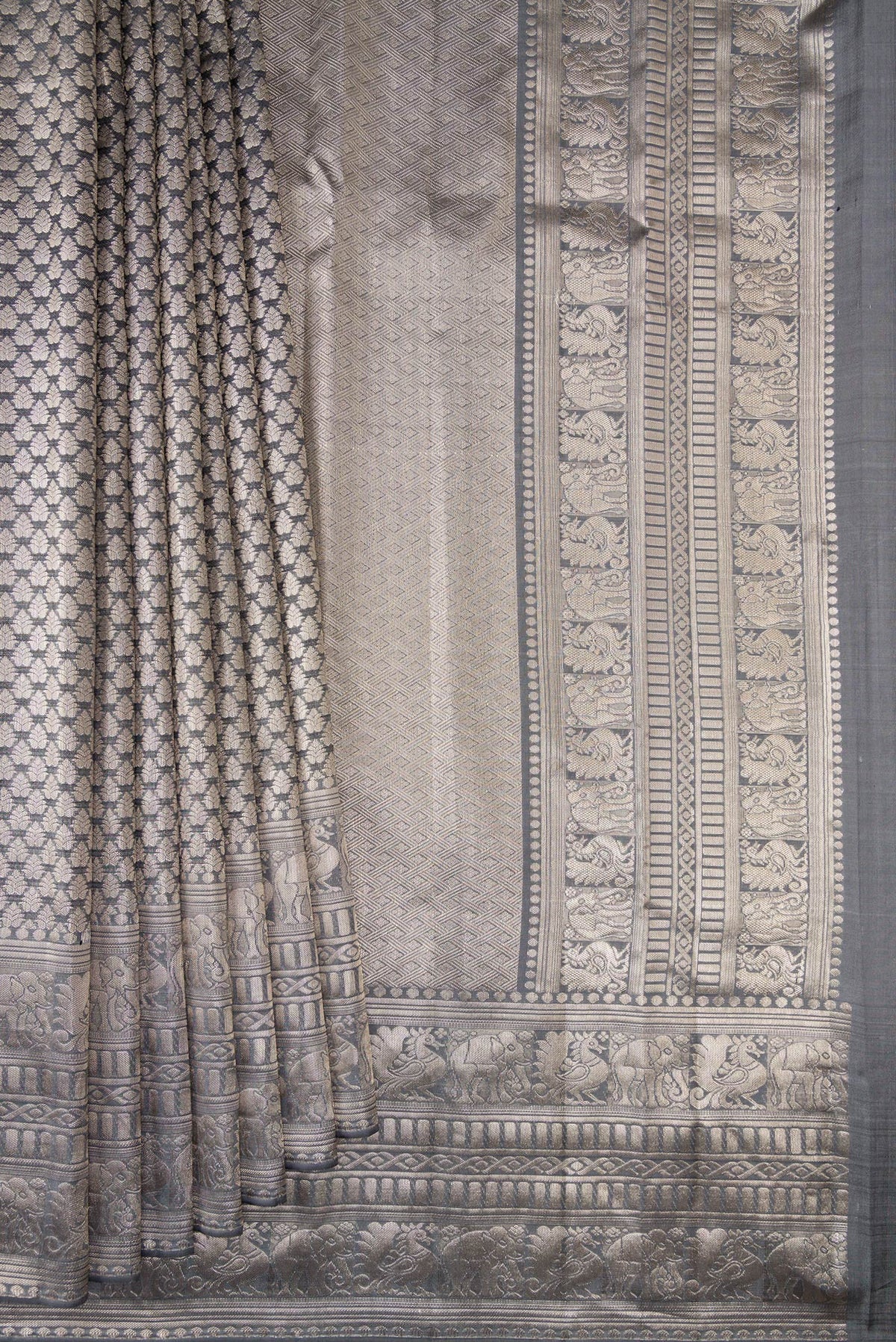 Pleats and pallu of Grey Kanchipuram Tissue Saree with Zari Brocade on the body and Fancy Border. 