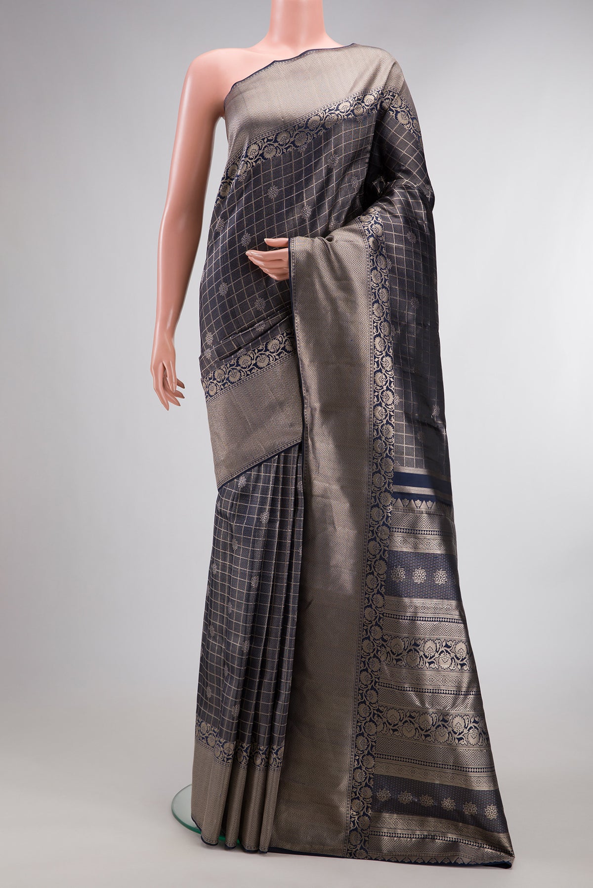 Navy Blue Dual Tone Kanchipuram Tissue Saree with Zari Brocade on the body and Fancy Border.  displayed on a mannequin