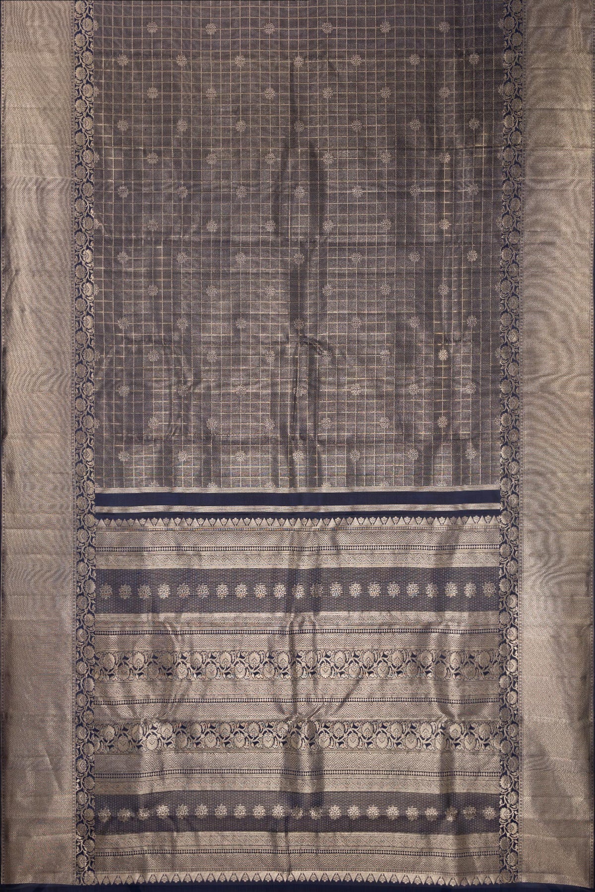 Flat view of Navy Blue Dual Tone Kanchipuram Tissue Saree with Zari Brocade on the body and Fancy Border. 