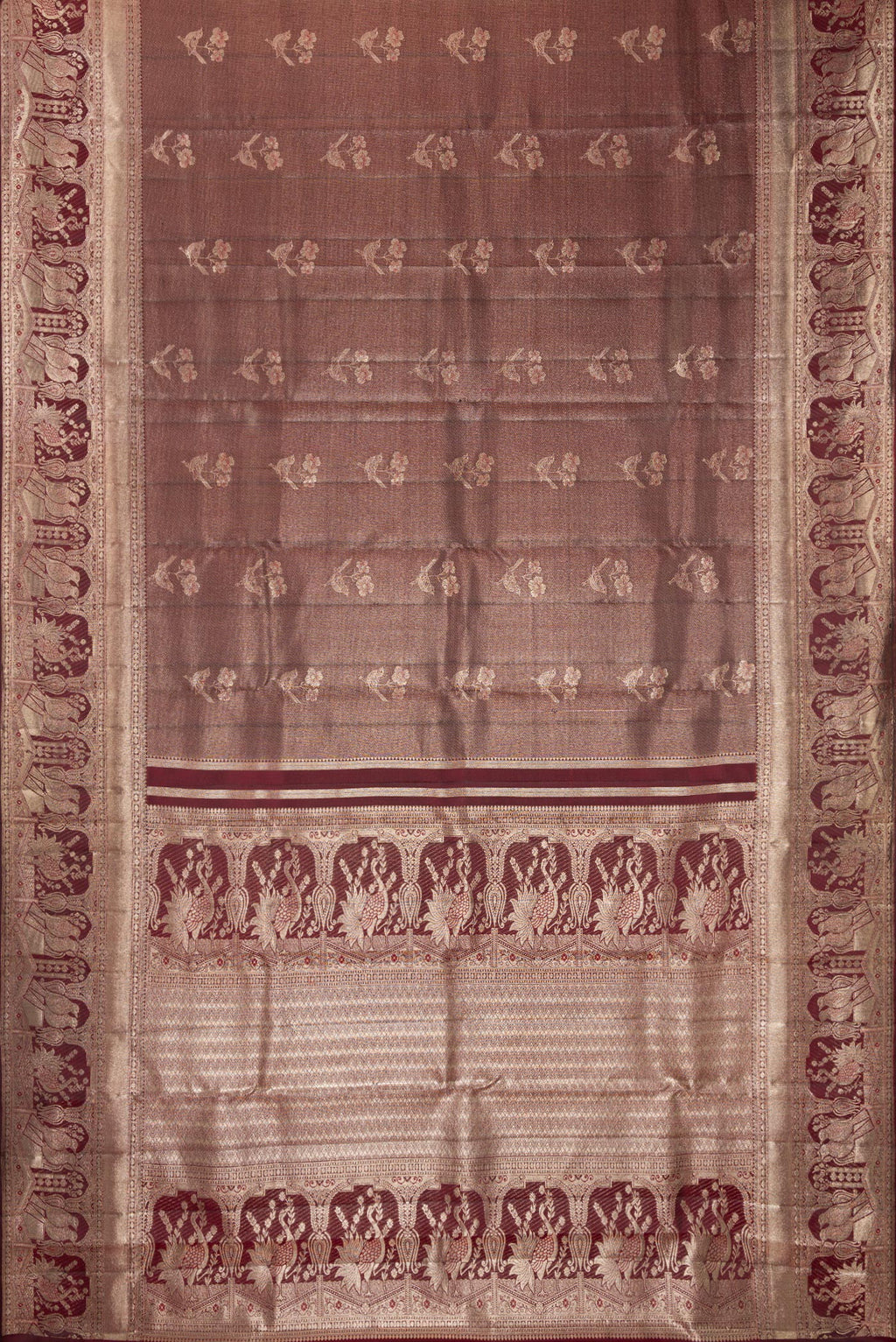 Flat view of Maroon Dual Tone Kanchipuram Tissue Saree with Zari Brocade on the body and Fancy Border. 