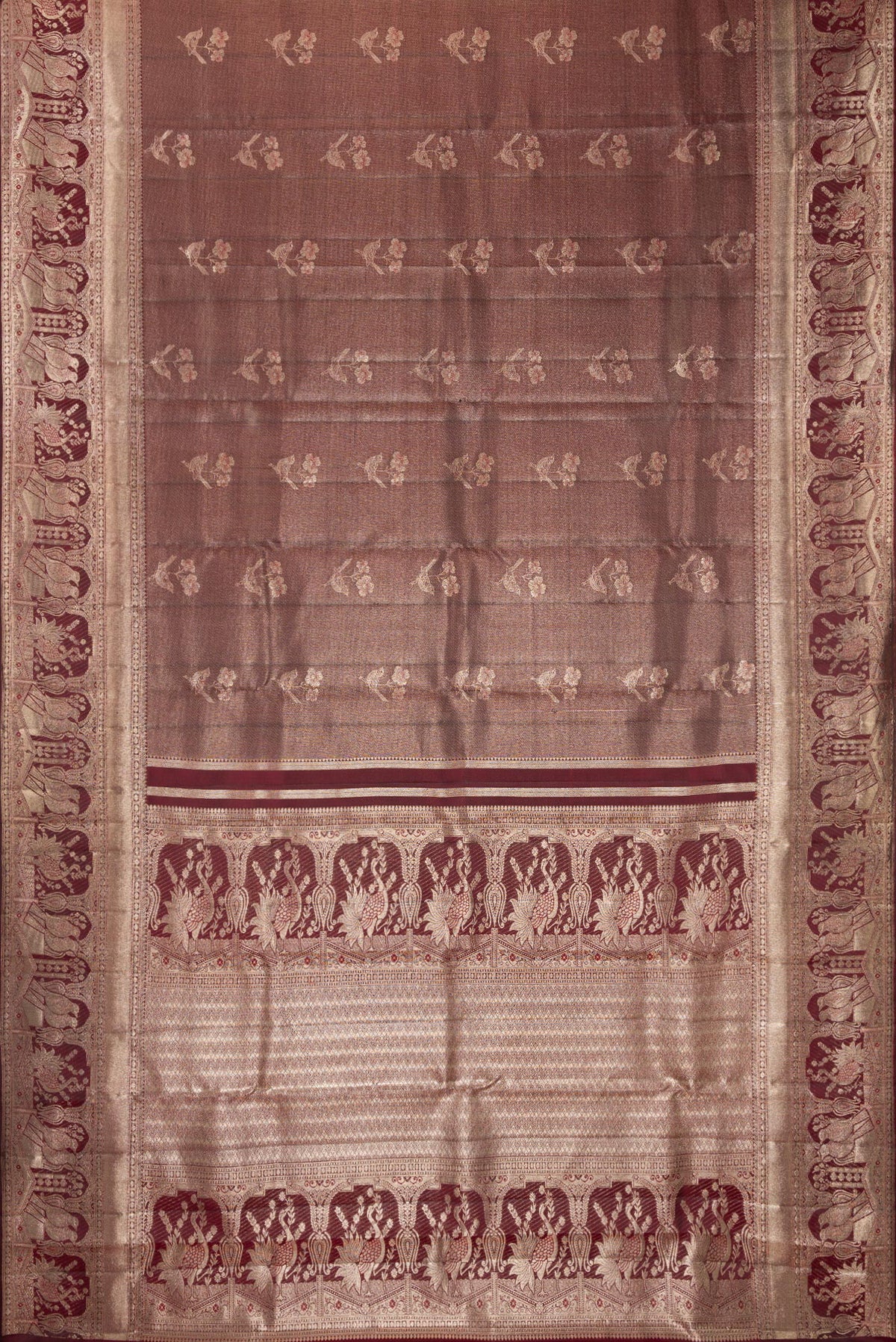 Flat view of Maroon Dual Tone Kanchipuram Tissue Saree with Zari Brocade on the body and Fancy Border. 