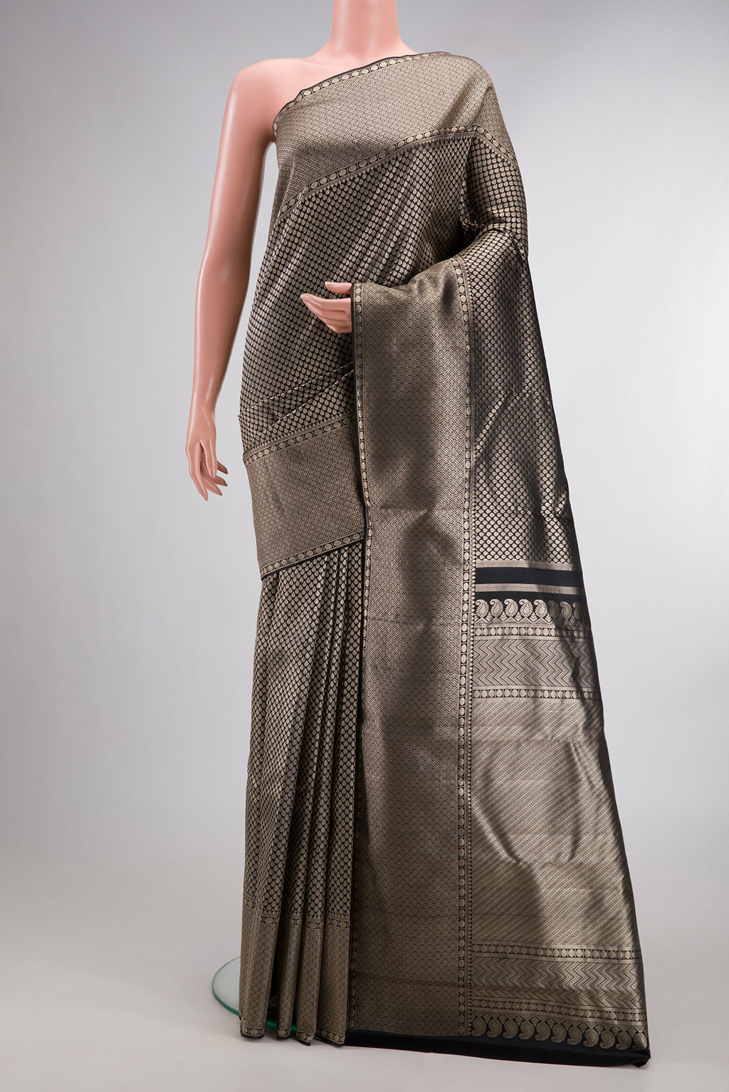 Black Dual Tone Kanchipuram Tissue Saree with Zari Brocade on the body and Zari Border.  displayed on a mannequin