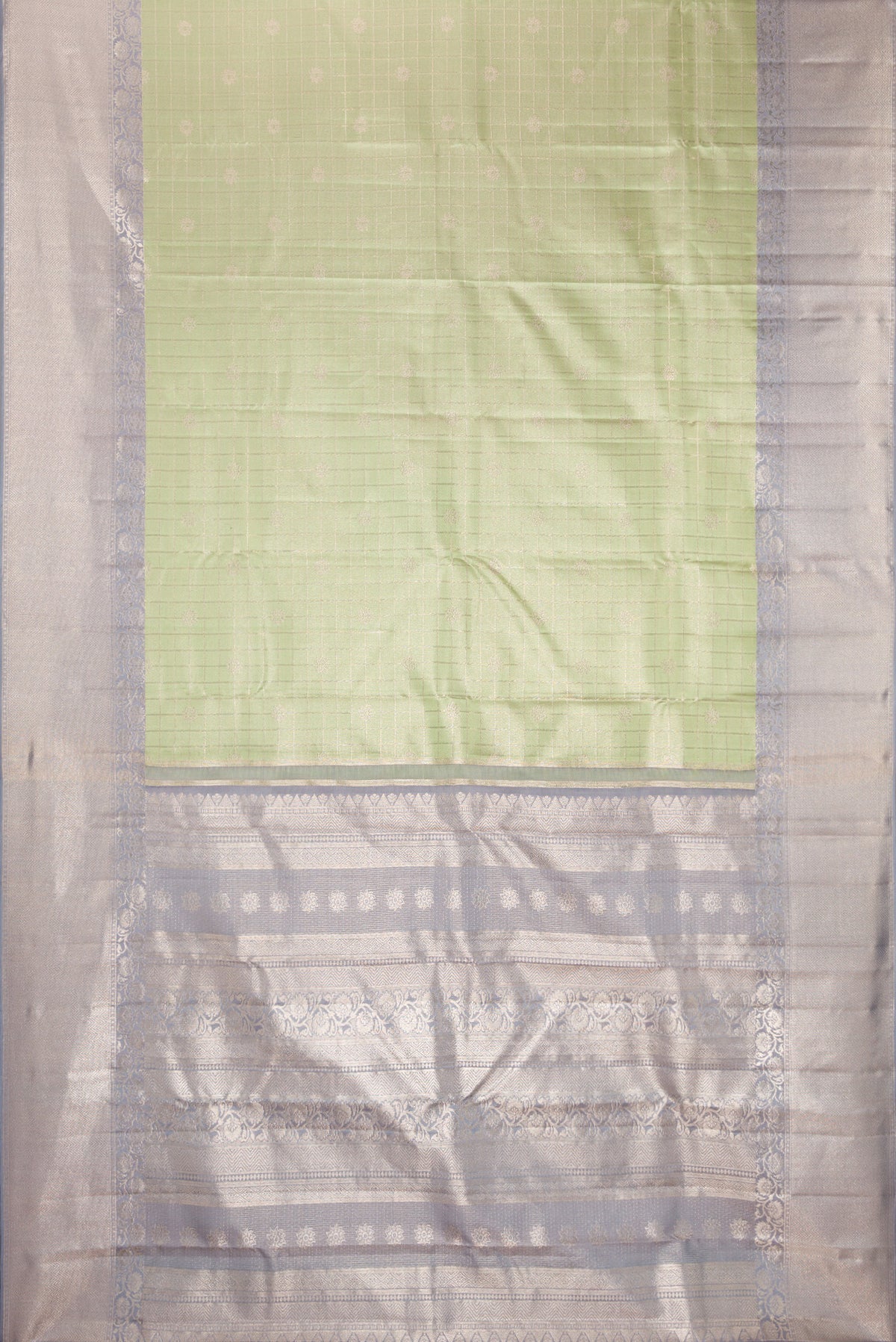 Flat view of Pista Green Kanchipuram Tissue Saree with Checked design on the body and Fancy Border. 