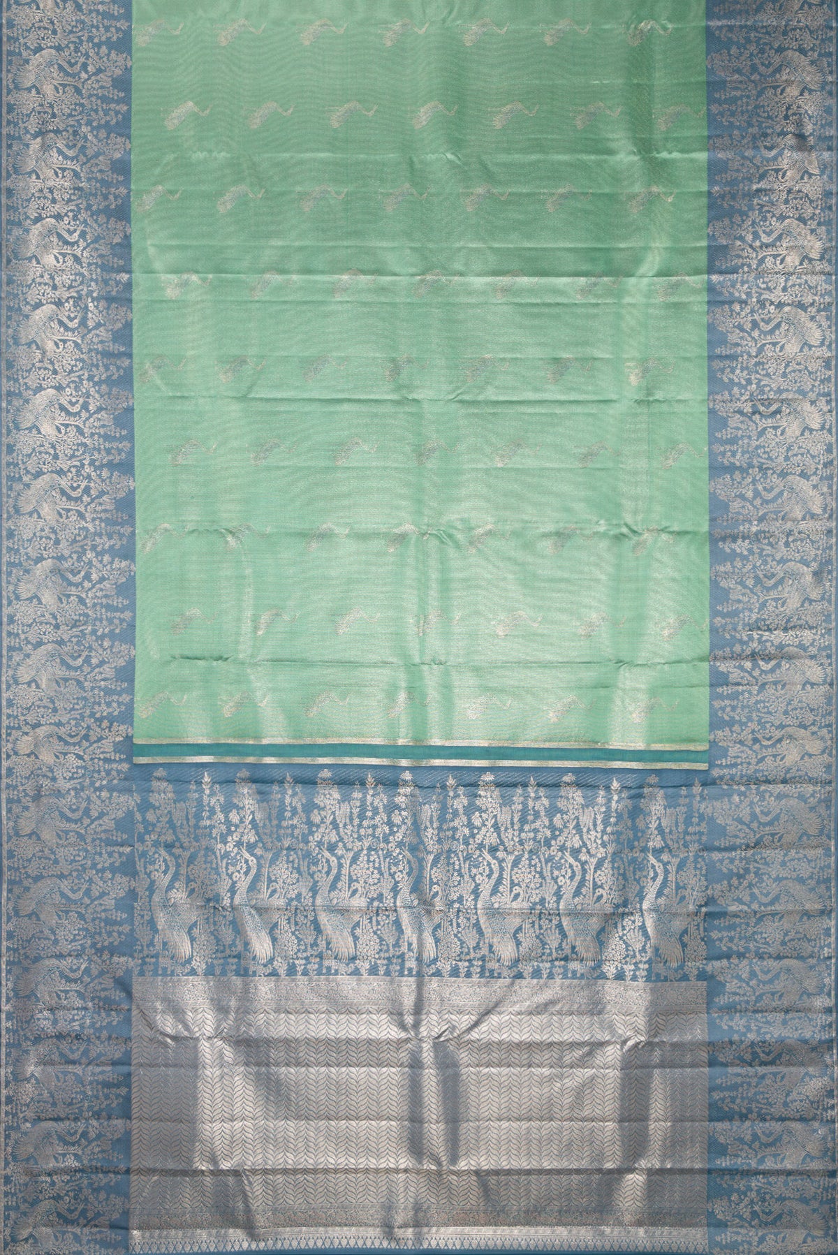 Flat view of Sea Green Dual Tone Kanchipuram Tissue Saree with Zari Brocade on the body and Fancy Border. 