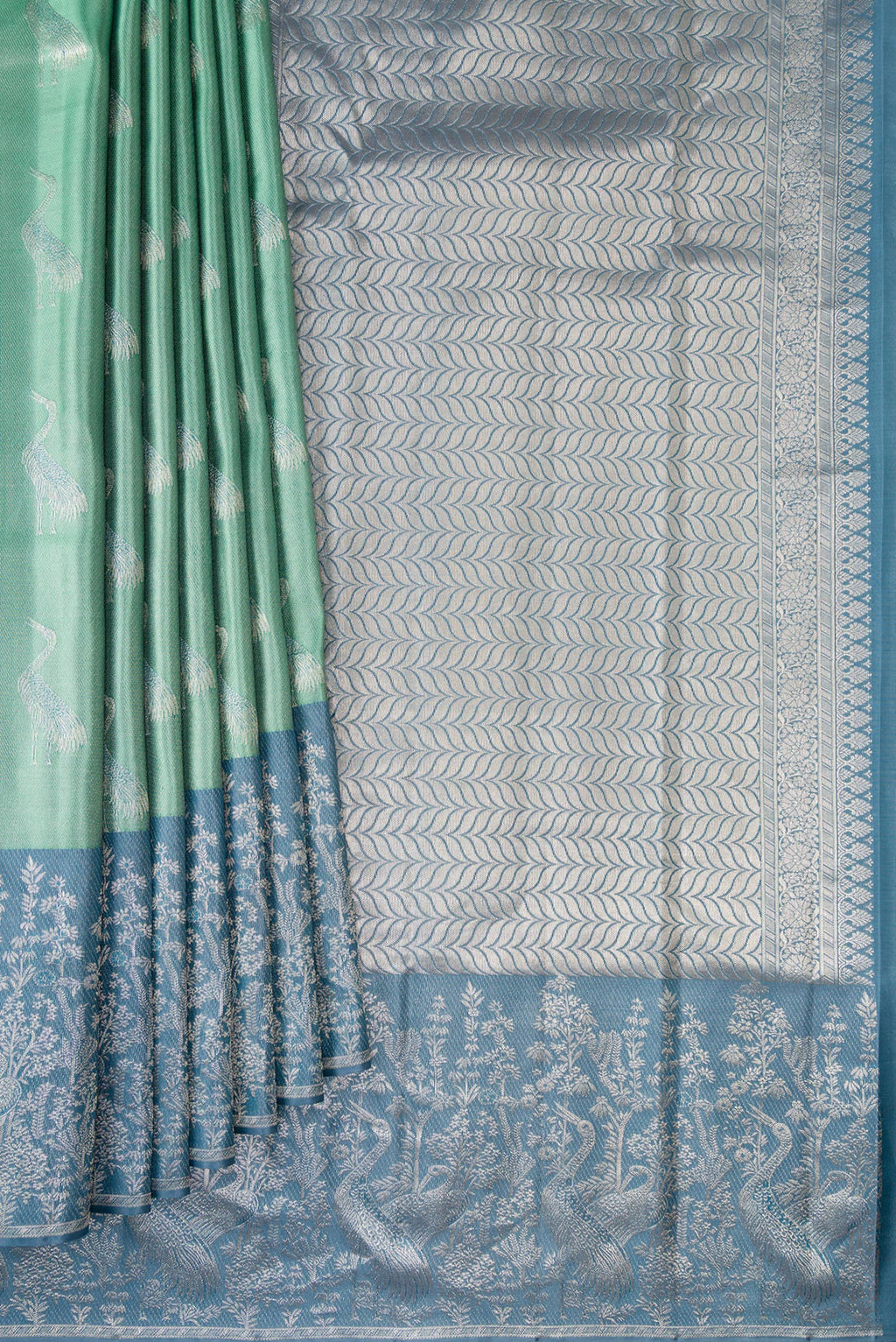 Pleats and pallu of Sea Green Dual Tone Kanchipuram Tissue Saree with Zari Brocade on the body and Fancy Border. 