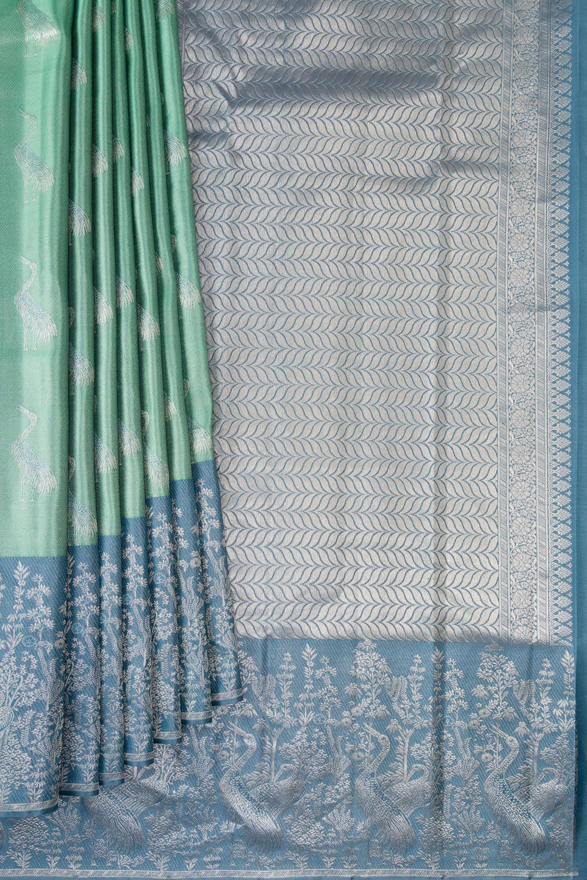 Pleats and pallu of Sea Green Dual Tone Kanchipuram Tissue Saree with Zari Brocade on the body and Fancy Border. 
