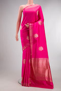 Pure Silk Pink Banarasi Saree with Zari Butta on the body and Zari Border.  displayed on a mannequin
