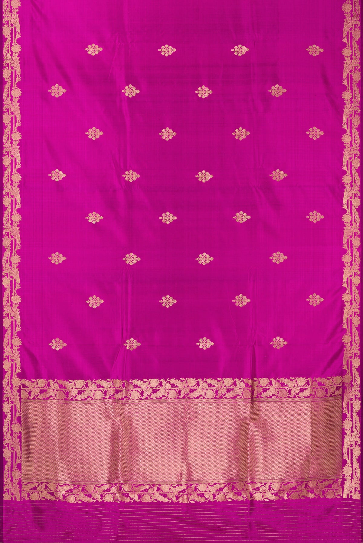 Flat view of Pure Silk Rani Pink Banarasi Saree with Zari Butta on the body and Zari Border. 