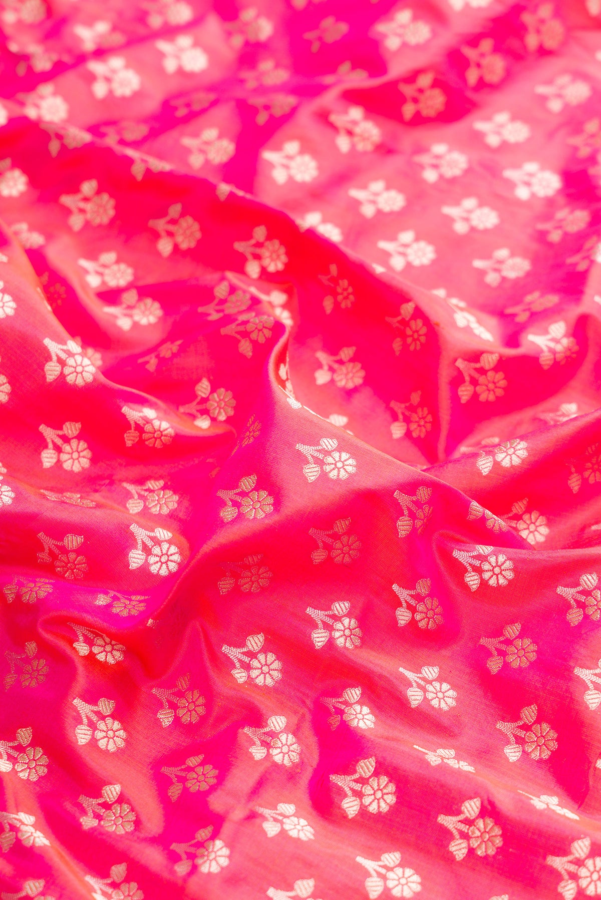 Close up of Pure Silk Pink Banarasi Saree with Zari Butta on the body and Zari Border.  displaying folds