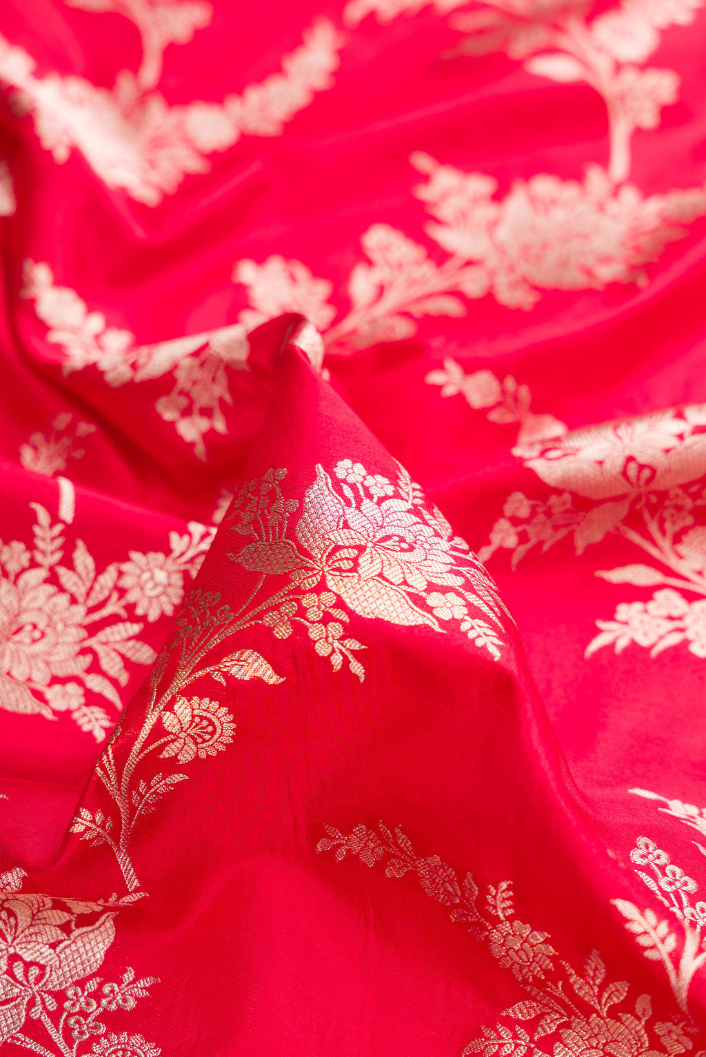 Close up of Pure Silk Red Dual Tone Banarasi Saree with Zari Brocade on the body and Zari Border.  displaying folds