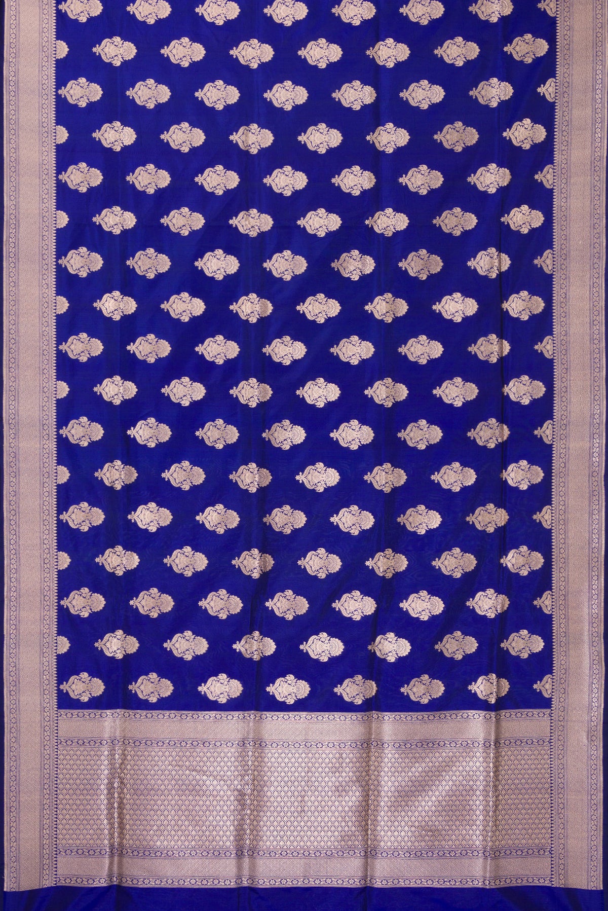 Flat view of Pure Silk Royal Blue Banarasi Saree with Zari Butta on the body and Zari Border. 
