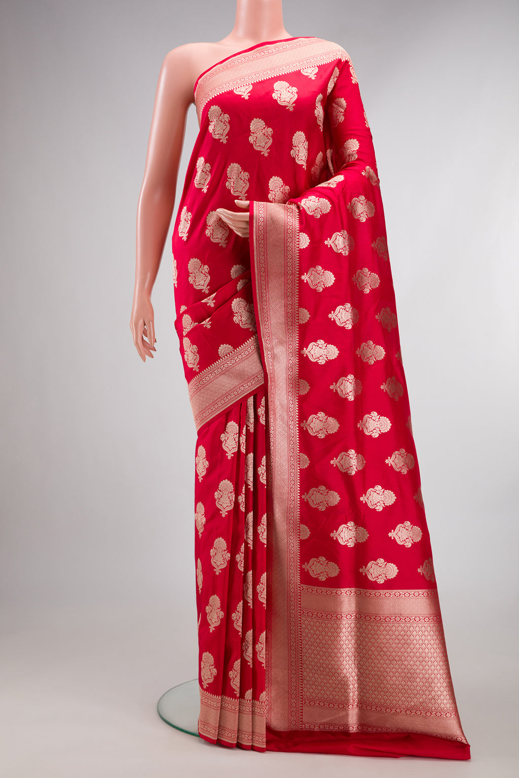 Pure Silk Red Banarasi Saree with Zari Butta on the body and Zari Border.  displayed on a mannequin